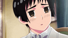 a close up of a person 's face with a sad look on his face