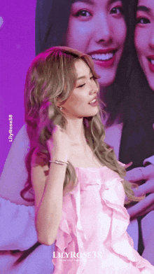 a woman in a pink dress with the word lily on the bottom right