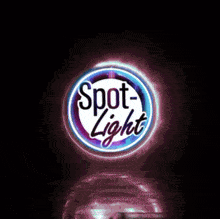 a neon sign that says spot light is lit up