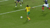 a soccer player in a yellow jersey with the number 8 on it