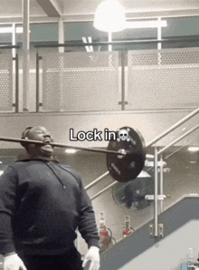 a man lifting a barbell in a gym with the words lock in at the bottom