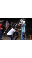a man with blood on his face is being helped by a group of people