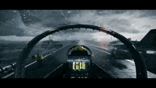 a cockpit of a fighter jet with the letters eeee on the screen