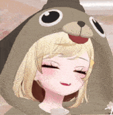 a girl with blonde hair is wearing a hoodie that looks like a dog