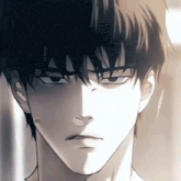 a close up of a man 's face with a serious expression on his face .