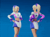 two cheerleaders are standing next to each other and one has a ponytail