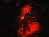 a person is standing in front of a red light
