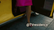 a woman in a pink dress is getting out of a yellow taxi with the caption @tvresidence