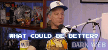 a man sitting in front of a microphone with the words what could be better