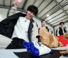 a man is holding a bag that says ' sodium ' on it