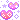 a pixel art illustration of two pink hearts with stars around them .