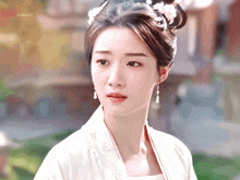 a close up of a woman 's face with a gif that says ' guifufu ' on it