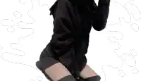a person wearing a black hoodie and black knee high socks
