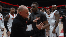 a group of iowa state basketball players are standing on a court