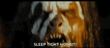 a close up of a monster with its mouth open and the words `` sleep tight hobbit '' .