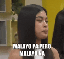 a woman with long black hair is making a funny face with the words malayo pa pero malayo na