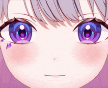 a close up of a girl 's eyes with purple reflections