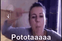 a woman is making a funny face and says ' potokaaa ' on the bottom .