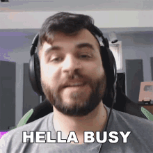 a man wearing headphones says hello busy