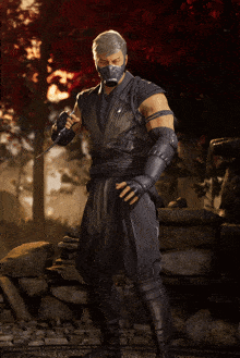 a man in a mask is holding a sword in his hand