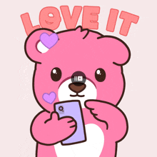a pink teddy bear is holding a cell phone with the words love it written above it