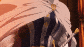 a person with a white cape and a sword with a cross on it