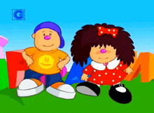 a boy with a smiley face on his shirt and a girl with a bow in her hair
