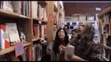 It'S Just Out Of My Reach. GIF - Portlandia Feminist Bookstore Library GIFs