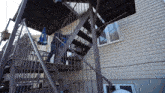 a person walking up a set of stairs with a blue umbrella that says pepsi on it