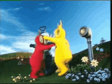 a group of teletubbies dancing in a field
