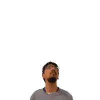 a man wearing glasses looks up at the number 13 above his head