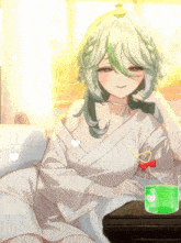 a girl with green hair sits on a couch next to a glass