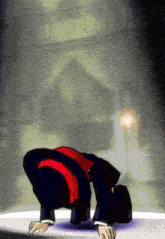 a man in a suit is bending over on his knees