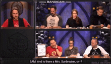 a group of people are sitting at a table with a sign that says sam and is there a mrs. sunbreaker or-?