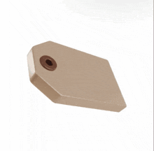 a brown tag with a small hole in the middle