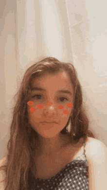 a young girl with red lips on her face