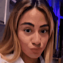 a close up of a woman making a funny face with her mouth open