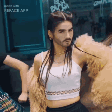 a man with a beard is wearing a white crop top and a fur coat ..