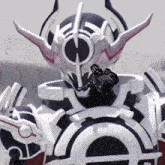 a close up of a robot with a gun in his hand