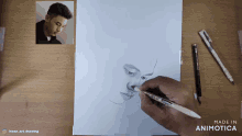 a drawing of a man 's face is being made in animatica