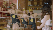 a group of people wearing aprons that say gma