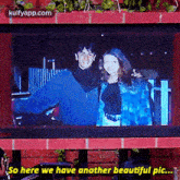 a man and a woman are standing next to each other on a screen with the words so here we have another beautiful pic .