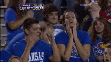 a group of people wearing blue shirts that say barsas