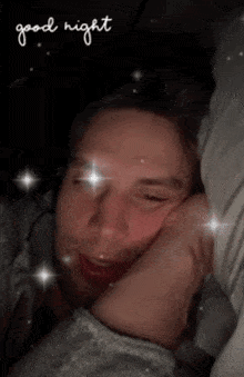 a man laying in bed with his eyes closed and the words " good night " written above him