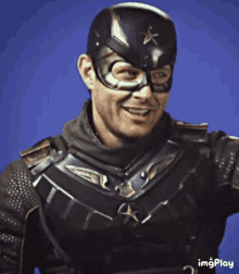 a man in a superhero costume with a star on his hat