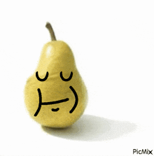 a picture of a pear with a sad face drawn on it by picmix