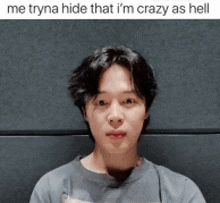 a picture of a young man with a caption that says me tryna hide that i 'm crazy as hell