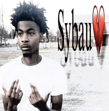 a young man giving the middle finger in front of a sybau logo