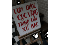 a sign on a wooden easel that says lum duc cuc vang