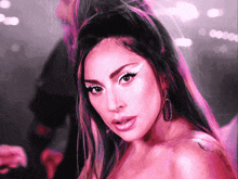 lady gaga is wearing a pink dress and white eye shadow